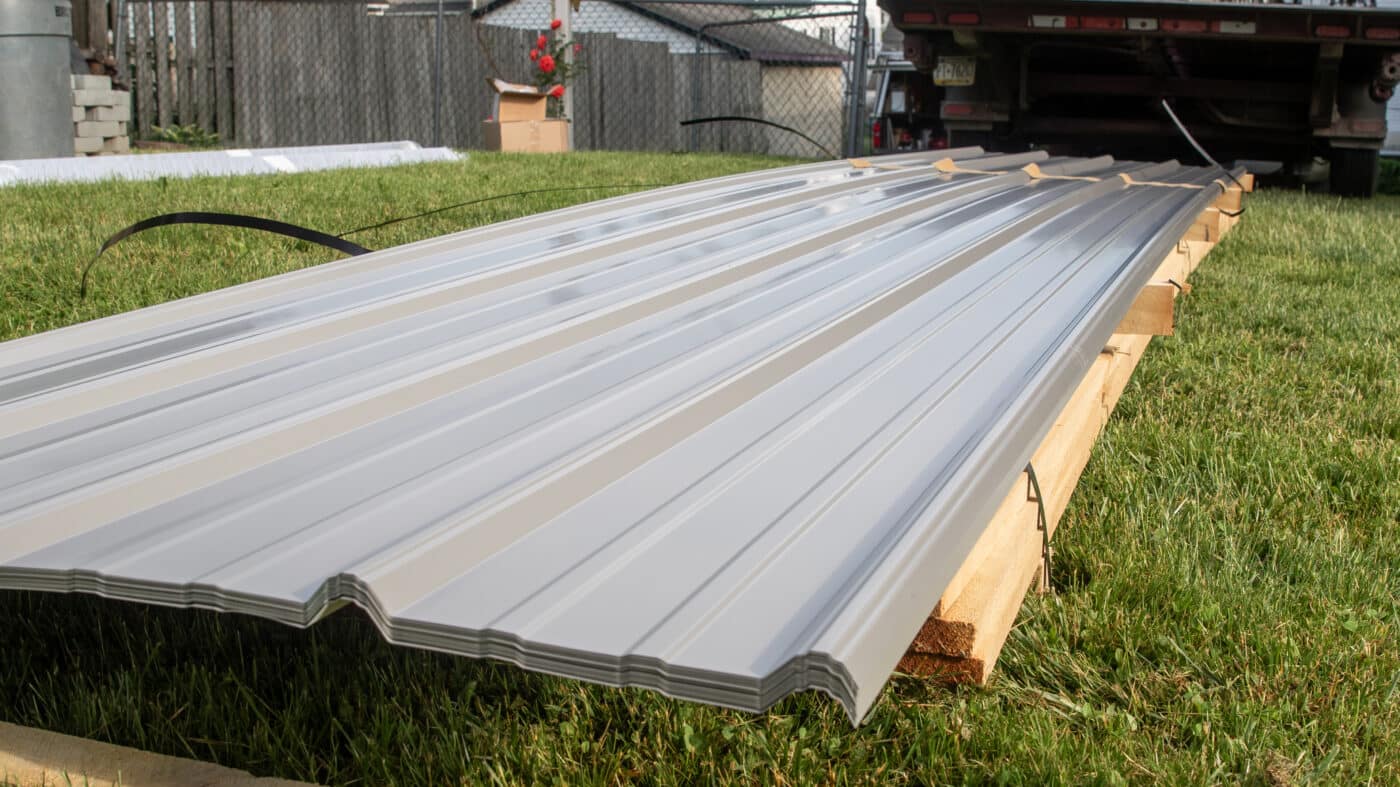Metal panels cut to size ready for installation on a roof 1400x787